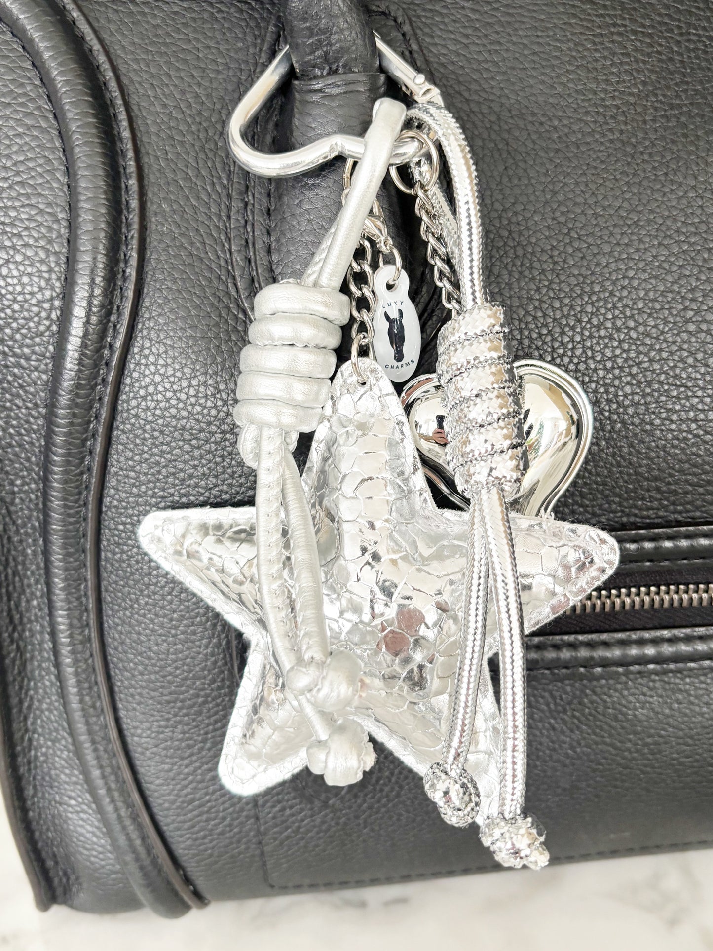 The Silver Stardust Charm