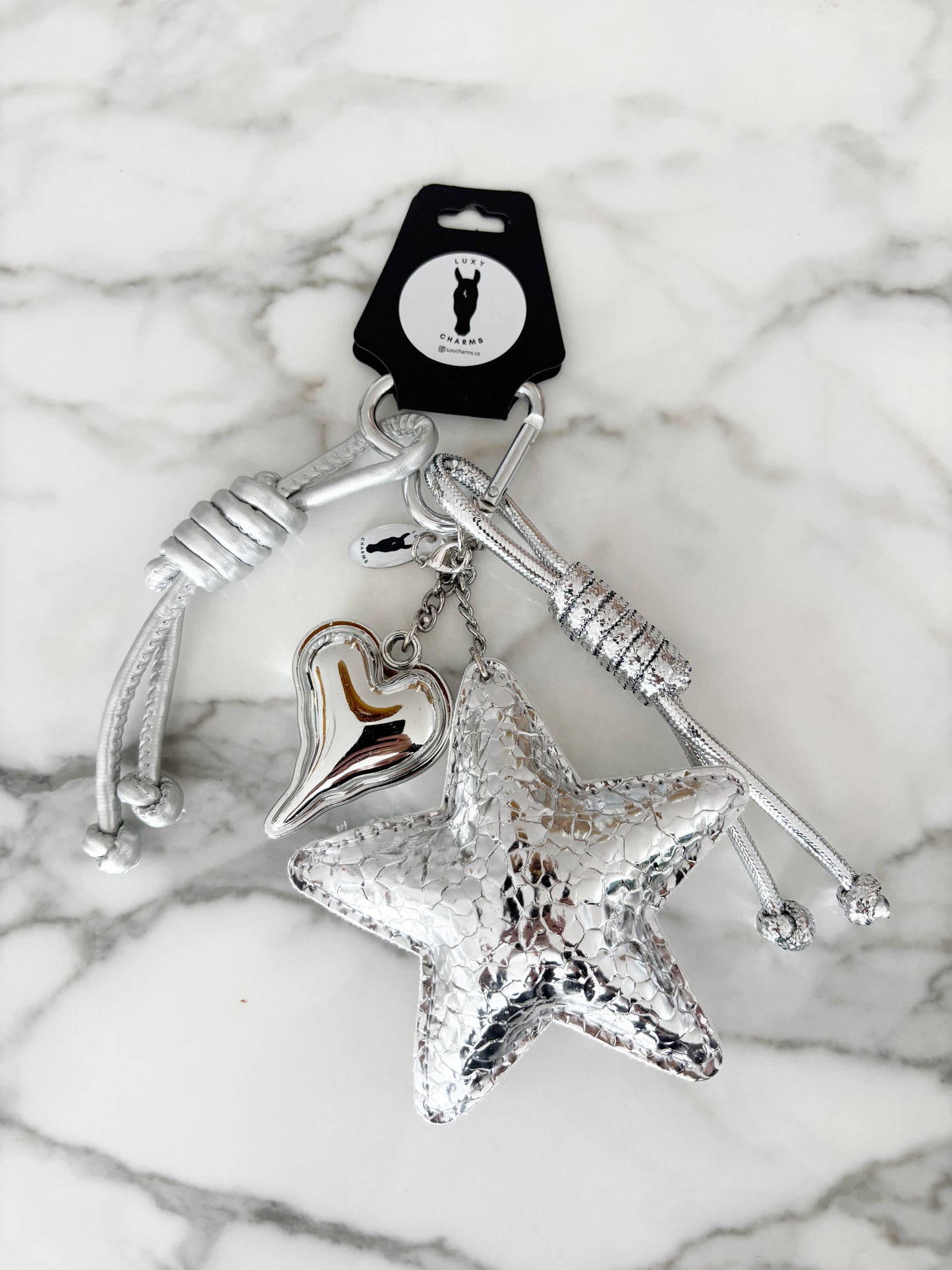 The Silver Stardust Charm